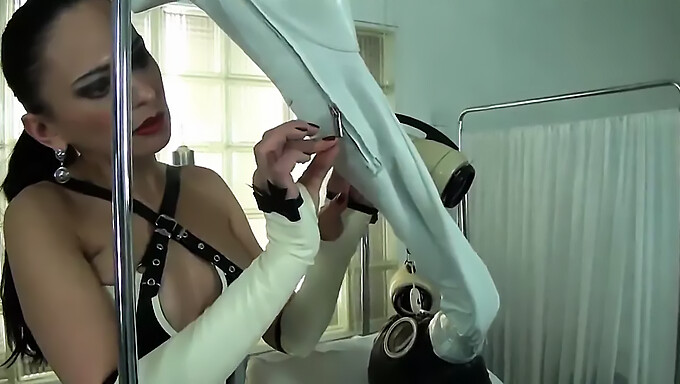 Latex-Clad Mistress Dominates With High Heels And Breathplay